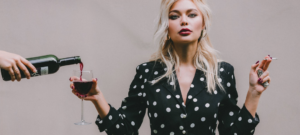 woman with cigarette and glass of wine